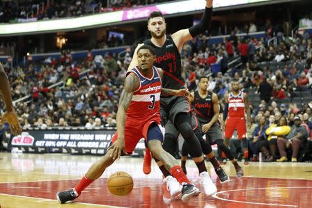 Nov 18, 2018; Washington, DC, USA; Washington Wizards guard Bradley Beal (3) dribbles the ball as Portland Trail Blazers center Jusuf Nurkic (27) defends during the second quarter at Capital One Arena. Mandatory Credit: Amber Searls-USA TODAY Sports