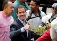 Venezuela's opposition leader Juan Guaido, who many nations have recognized as the country's rightful interim ruler, gestures at a protest of the public transport sector against the government of Venezuela's President Nicolas Maduro in Caracas, Venezuela February 20, 2019. REUTERS/Manaure Quintero