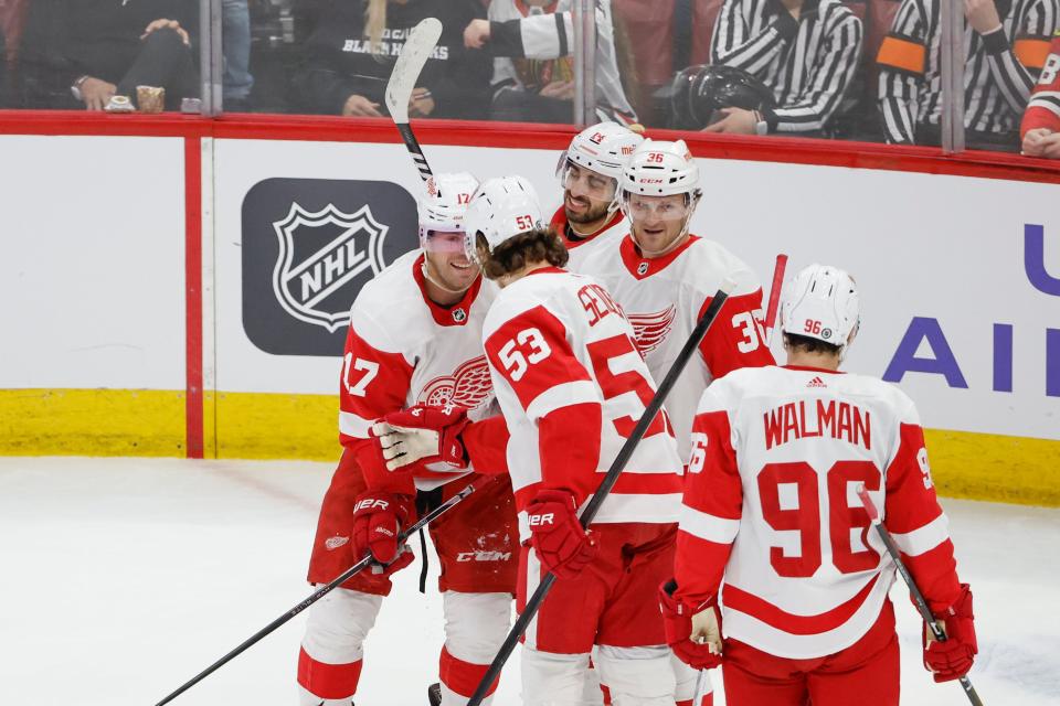 Detroit Red Wings right wing Daniel Sprong (17) celebrates with teammates after scoring against the Chicago Blackhawks during the first period at United Center in Chicago on Sunday, Feb. 25, 2024.
