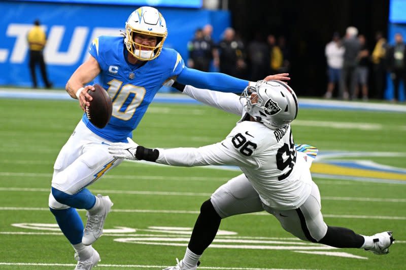 Los Angeles Chargers quarterback Justin Herbert (L) signed a $262.5 million contract in July. File Photo by Jon SooHoo/UPI
