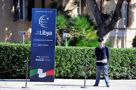 A policeman stands guard inside Villa Igiea, the venue of the international conference on Libya in Palermo, Italy, November 12, 2018. REUTERS/Guglielmo Mangiapane