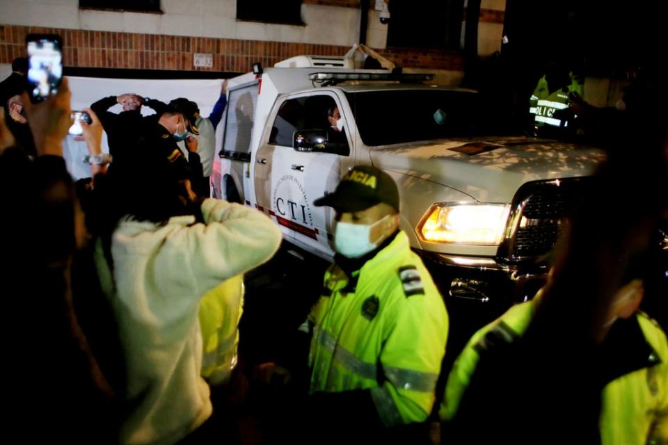 Emergency workers outside the Four Seasons Hotel Casa Medina (AP)