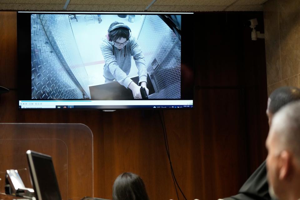 Ethan Crumbley is shown at a shooting range in a video displayed in court on Thursday, July 27, 2023, in Pontiac, Mich. Oakland County judge Kwame Rowe is hearing evidence starting Thursday to help him decide whether the teen who killed four students and injured six others and a teacher in November 2021 at Oxford High School should be sentenced to prison without the chance of parole.