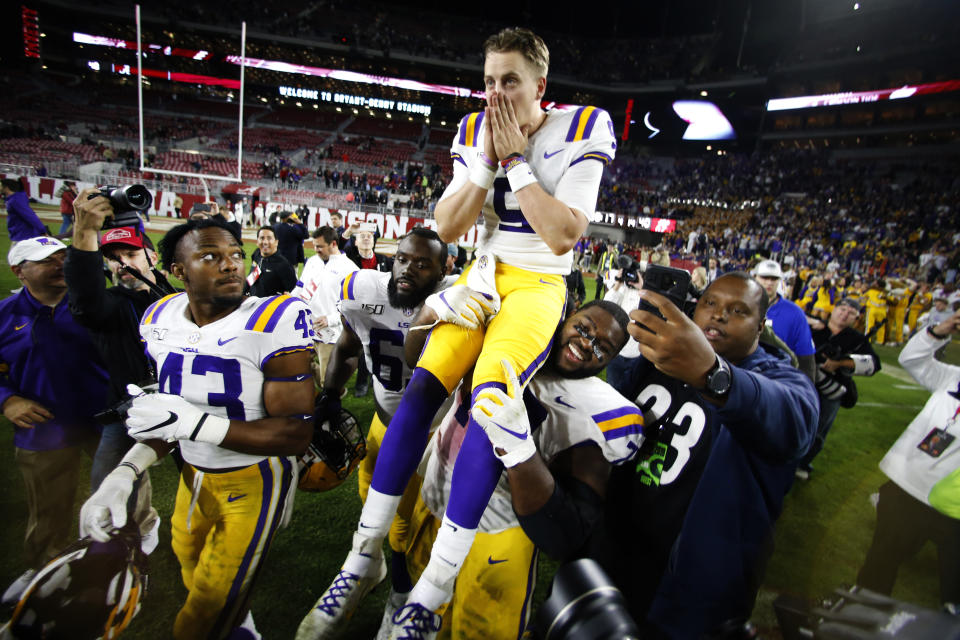 LSU quarterback Joe Burrow (9) is carried off the field by his teammates after defeating Alabama 46-41 in an NCAA college football game, Saturday, Nov. 9, 2019, in Tuscaloosa , Ala. (AP Photo/John Bazemore)