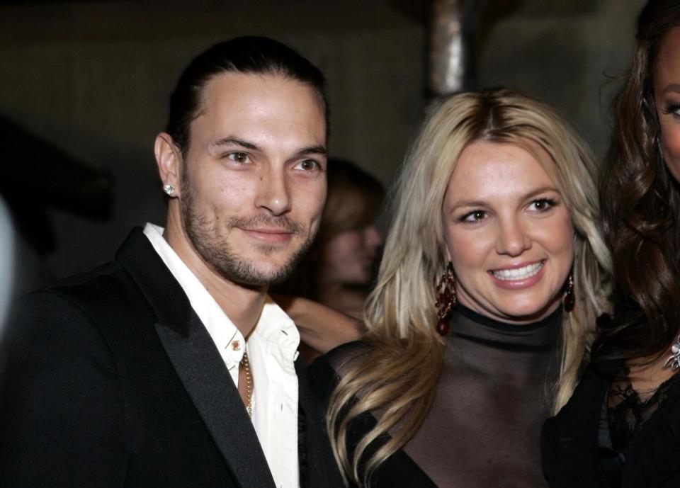 Kevin Federline and Britney Spears smile for photographers on an evening out