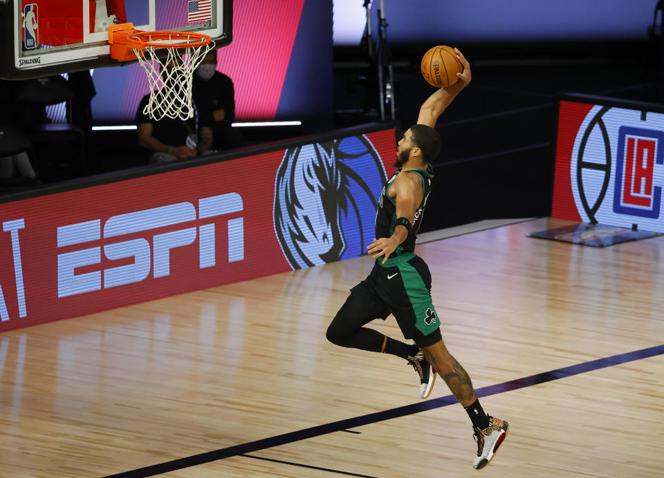 Jayson Tatum (0) of the Boston Celtics dunks against the Toronto Raptors during the second quarter at The Field House at ESPN Wide World Of Sports Complex on Aug. 30, 2020, in Lake Buena Vista, Florida. Kevin C. Cox/Getty Images