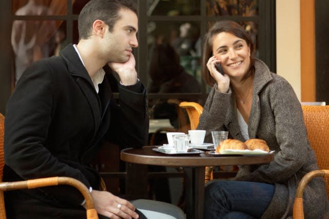 Couple at Outdoor Cafe, Woman Talking on Cell Phone, Paris, France
