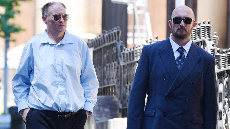 Brothers David (left) and Philip (right) Thompson arrive at the Supreme Court in Sydney, Friday, Octover 18, 2019. The brothers are accused of the manslaughter of their mother whilst she was in palliative care. (AAP Image/Dean Lewins) 