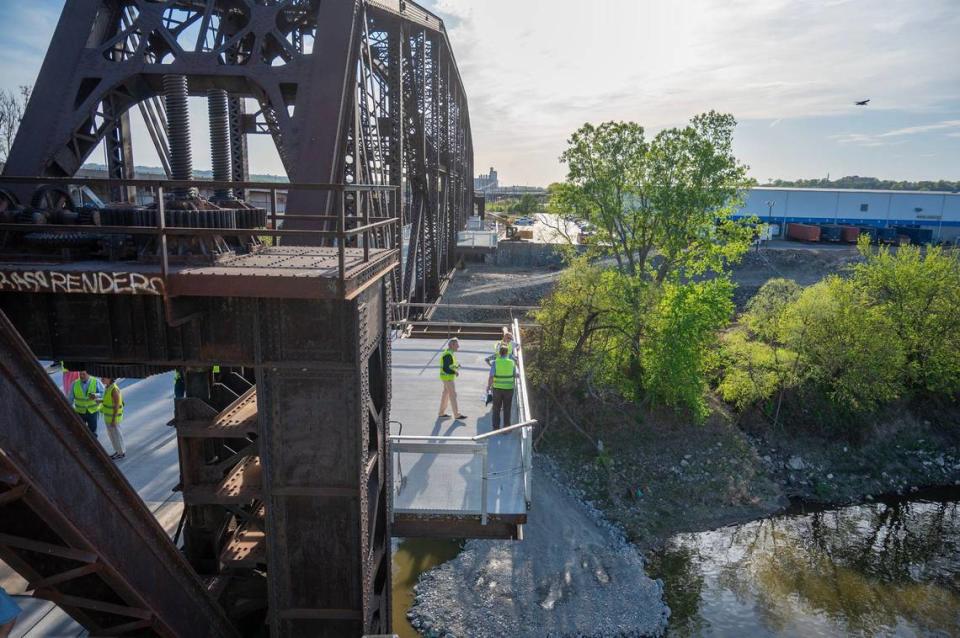 Guests walk on a viewing platform that is gradually taking shape and is still under construction at Rock Island Bridge on Wednesday, April 17, 2024, in Kansas City, Kansas.