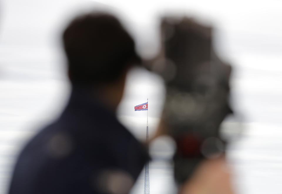 FILE - A North Korean flag flutters in the wind atop a 160-meter tower in North Korea's village Gijungdong as seen from the Taesungdong freedom village inside the demilitarized zone in Paju, South Korea on April 24, 2018. South Korea’s military said Sunday, April 16, 2023, it fired warning shots to repel a North Korean patrol vessel that temporarily crossed the countries’ disputed western sea boundary while chasing a Chinese fishing boat. (AP Photo/Lee Jin-man, File)