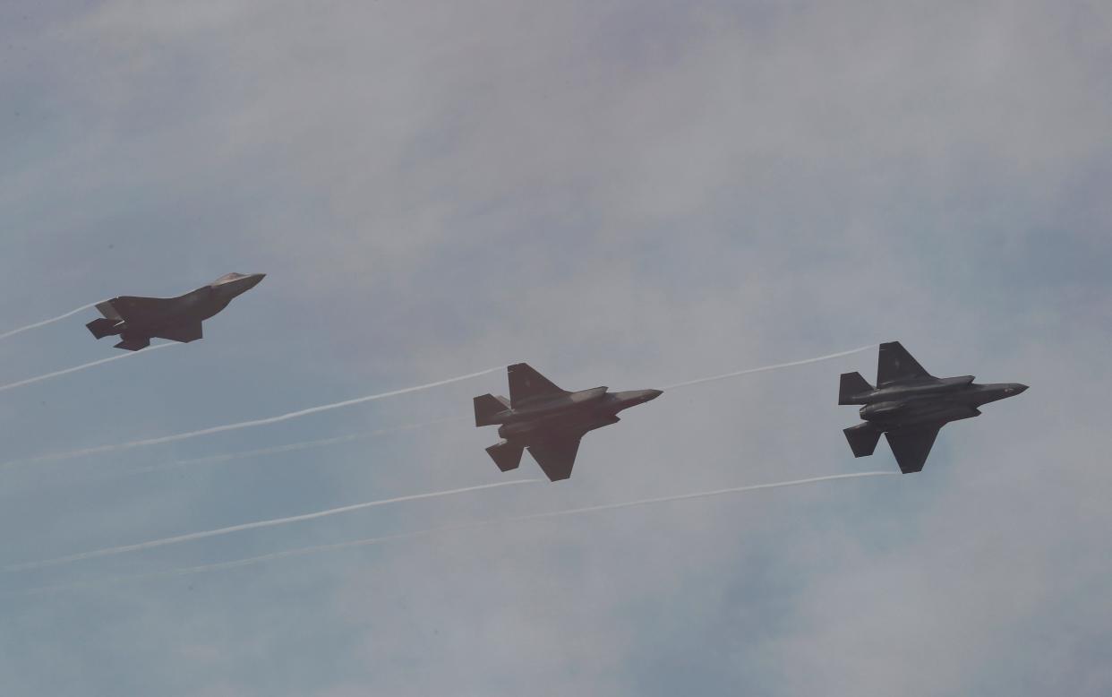 South Korean Air Force F-35 A Stealths fly by during the press day of the Seoul International Aerospace and Defense Exhibition 2019 at the Seoul Military Airport in Seongnam, South Korea, Monday, Oct. 14, 2019.