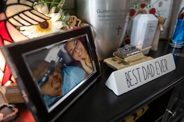 Memo “Tank” Garcia’s ashes are surrounded by photos and memorabilia from his life, in the family room of the Garcia home.