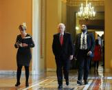 Senate Majority Leader Mitch McConnell (R-KY) walks to the Senate floor after a brief recess during the day's Senate impeachment trial of President Donald Trump in Washington