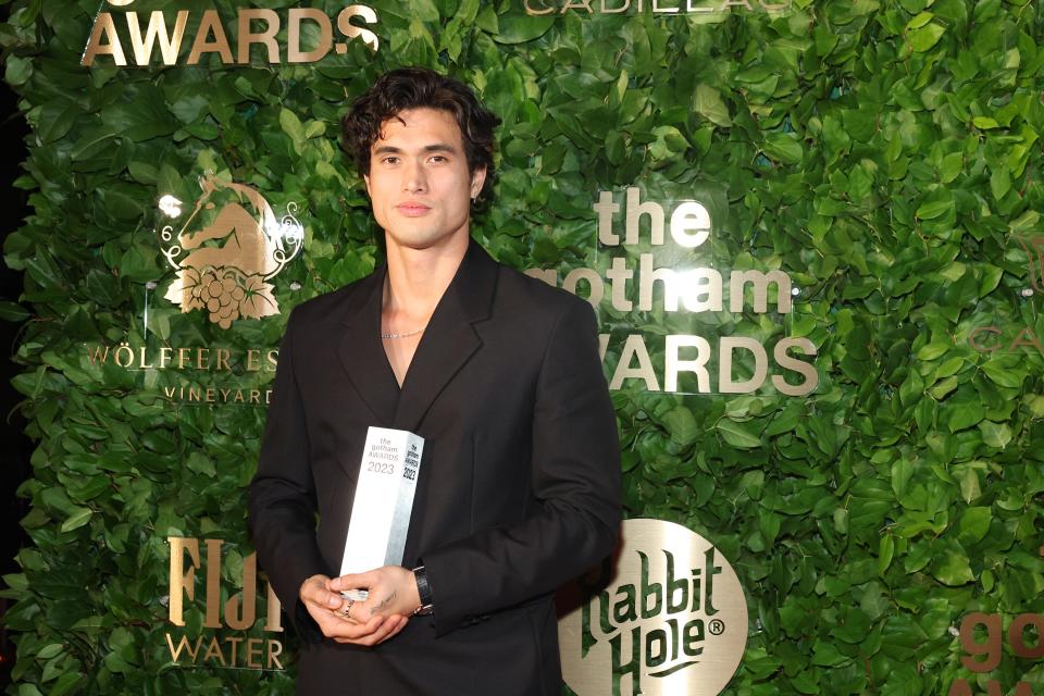 Charles Melton poses with his Gotham Award for outstanding supporting performance for Netflix's "May December."
