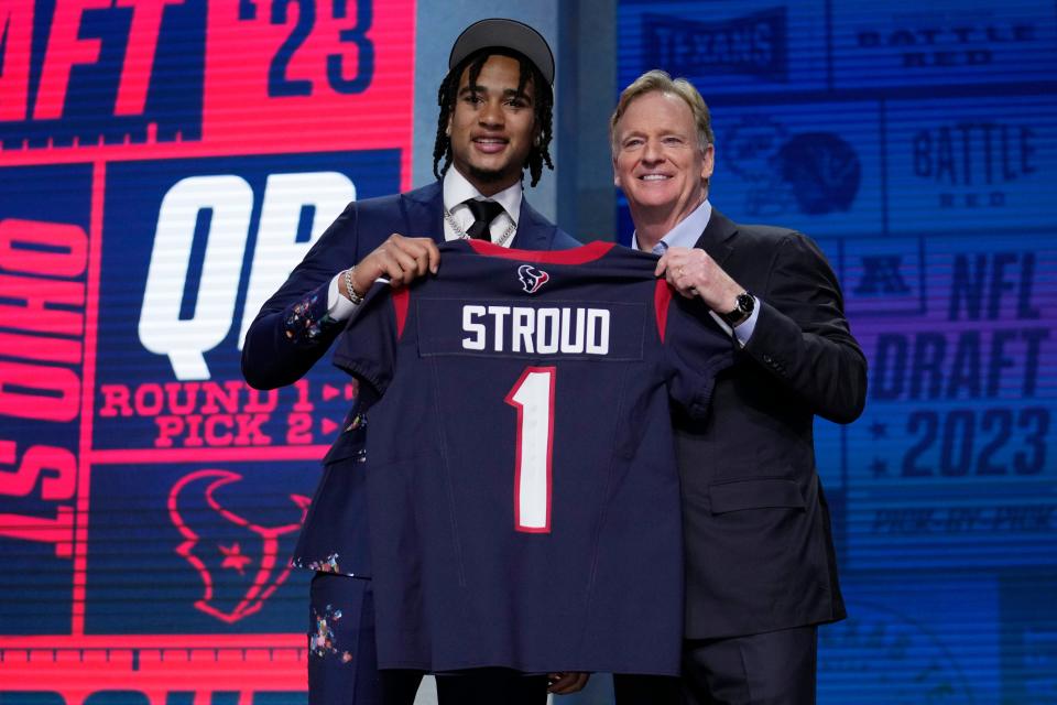 Ohio State quarterback C.J. Stroud, left, poses beside NFL Commissioner Roger Goodell after being chosen by the Houston Texans with the second overall pick during the first round of the NFL football draft on April 27, 2023, in Kansas City, Mo.