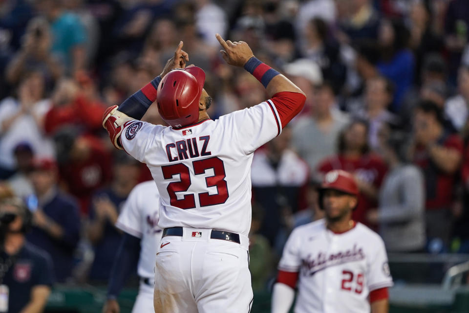 Washington Nationals designated hitter Nelson Cruz celebrates his there-run homer during the second inning of a baseball game against the New York Mets at Nationals Park, Wednesday, May 11, 2022, in Washington. (AP Photo/Alex Brandon)