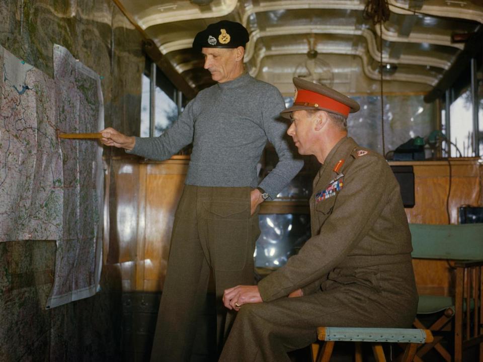 Field Marshal Sir Bernard Montgomery explaining Allied strategy to King George VI in his command caravan in Holland, October 1944 (Imperial War Museum )