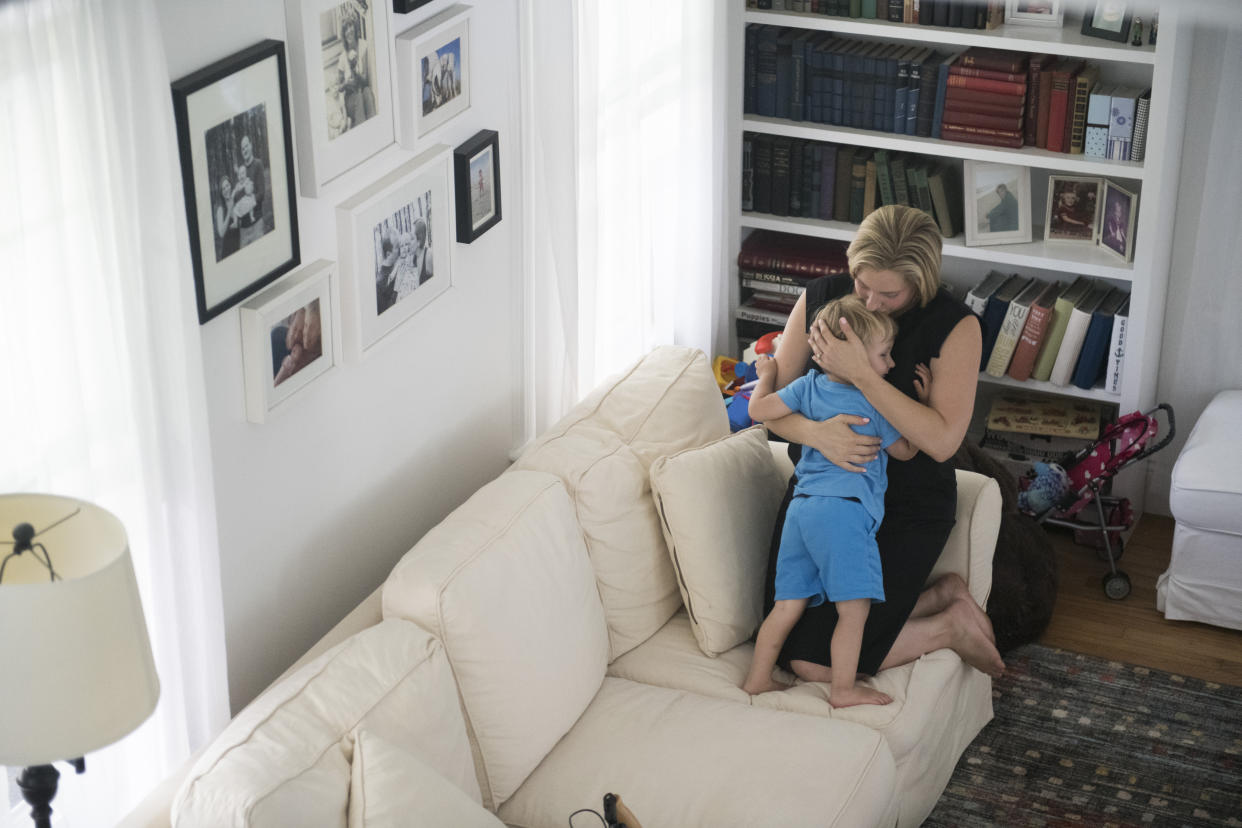 Congressional candidate Liuba Grechen Shirley, the first federal candidate to get permission to spend campaign funds on child care, takes a break from shooting her campaign ad to hug her son. (The Washington Post via Getty Images)