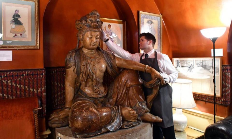 The carved wooden Buddha in Annabel’s nightclub auction