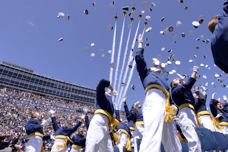 Newly commissioned 2nd lieutenants celebrate as the U.S. Air Force Thunderbirds fly over the U.S. Air Force Academy class of 2016 graduation ceremony at Falcon Stadium in Colorado Springs, Colo., on June 2, 2016. In 1955, the U.S. Air Force Academy in Colorado was dedicated, with 300 cadets in its first class. File Photo by Mike Kaplan/U.S. Air Force/UPI
