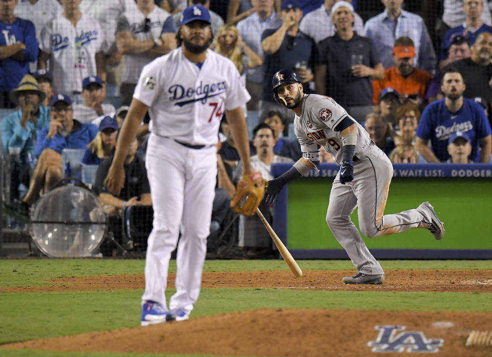 Marwin Gonzalez watches his home run off Kenley Jansen during the ninth inning of Game 2 of the World Series. (AP)