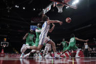 Italy's Alessandro Pajola (54), center, passes the ball during men's basketball preliminary round game against Nigeria at the 2020 Summer Olympics, Saturday, July 31, 2021, in Saitama, Japan. (AP Photo/Eric Gay)