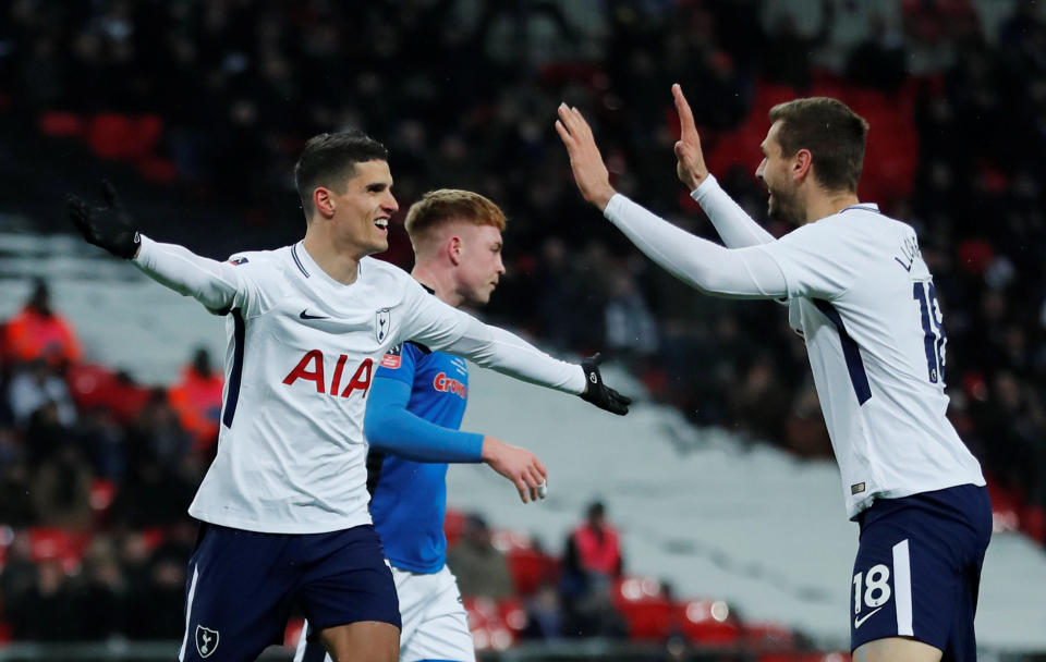 Tottenham’s Erik Lamela celebrates with Fernando Llorente after scoring a goal which is later disallowed by VAR
