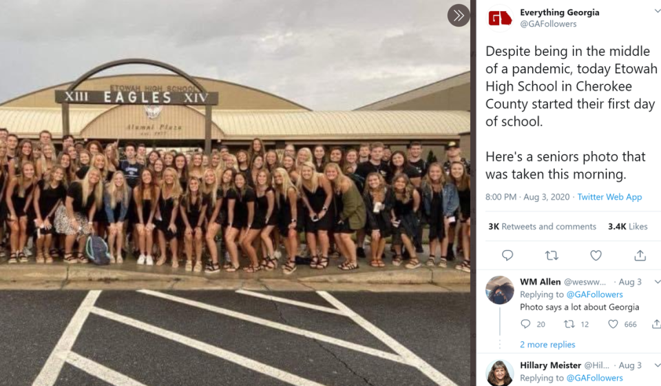 Students at Etowah High School in Woodstock pose for a “back to school” photo on their first day of classes Aug. 3.