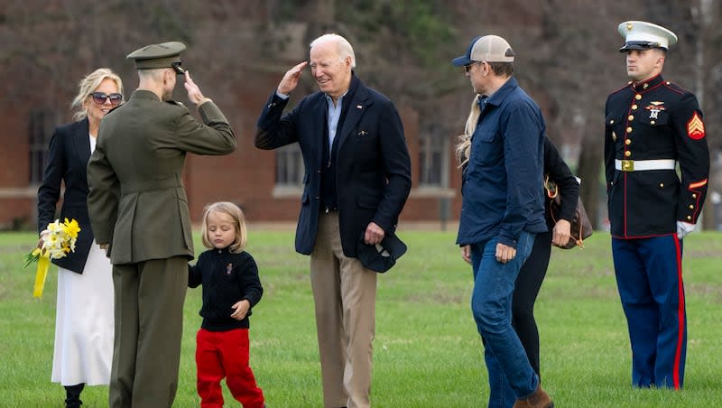 With first lady Jill Biden at left, holding hands with grandson Beau, President Joe Biden salutes on arrival at Fort McNair, Sunday, March 31, 2024, in Washington, upon return from Camp David. At right of Biden is his son, Hunter Biden. Trans Visibility Day coincided with Easter Sunday this year.