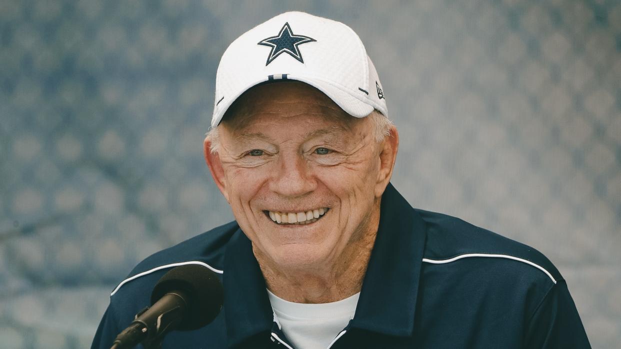 Dallas Cowboys owner Jerry Jones smiles during a press conference at the NFL football team training camp in Oxnard, Calif.