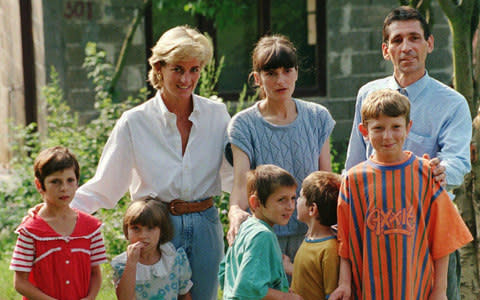 Diana with Muhamed and his family in 1997 - Credit: AP