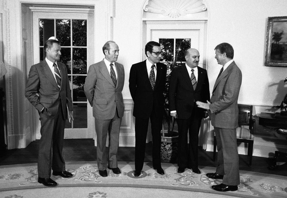 <p>President Jimmy Carter greets members of the Egyptian delegation to the Mideast peace talks at the White House, Washington on Oct. 11, 1978. From left: U.S. National Security Affairs Advisor Zbigniew Brzezinski, Amb. Alfred Atherton; acting Egyptian Foreign Minister Boutros Ghali, Egyptian Defense Minister General Kamel Hassan Ali, and Carter. (Photo: Cook/AP) </p>