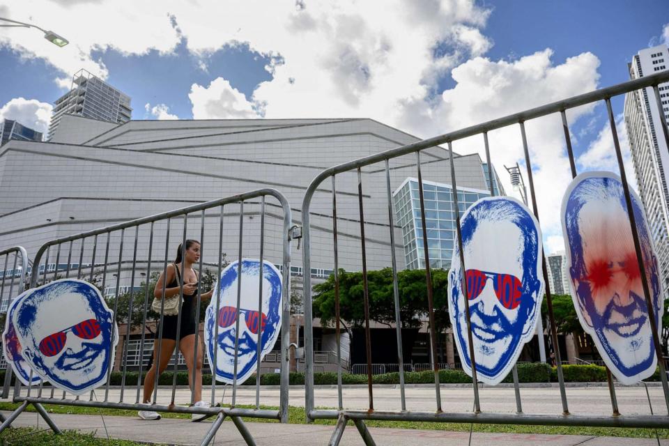 PHOTO: The Biden-Harris campaign put up “Dark Brandon” signs surrounding the venue for the third Republican presidential debate in Miami, on Nov. 8, 2023. (Mandel Ngan/AFP via Getty Images)