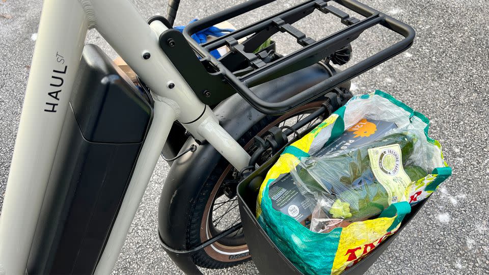 A pair of panniers mounted to the Haul ST's fork adapters can easily carry a grocery run, and the bike handles predictably and surely with the load up front and low down. - Erica Zazo/CNN Underscored