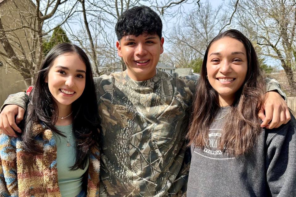 Three Immaculata Catholic School graduates have returned to the school to work in its Aftercare Program. From left to right are Johanna Montano, Pedro Convento and Arlin Carachure.
