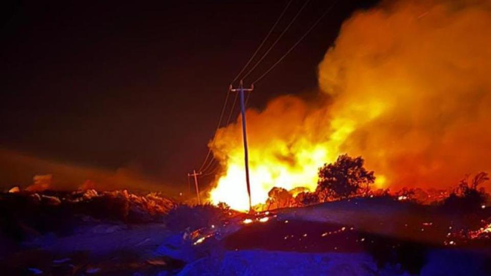 A bushfire burns close to powerlines in Western Australia's wheatbelt. Picture: Supplied/ Gingin West Volunteer Bush Fire Brigade