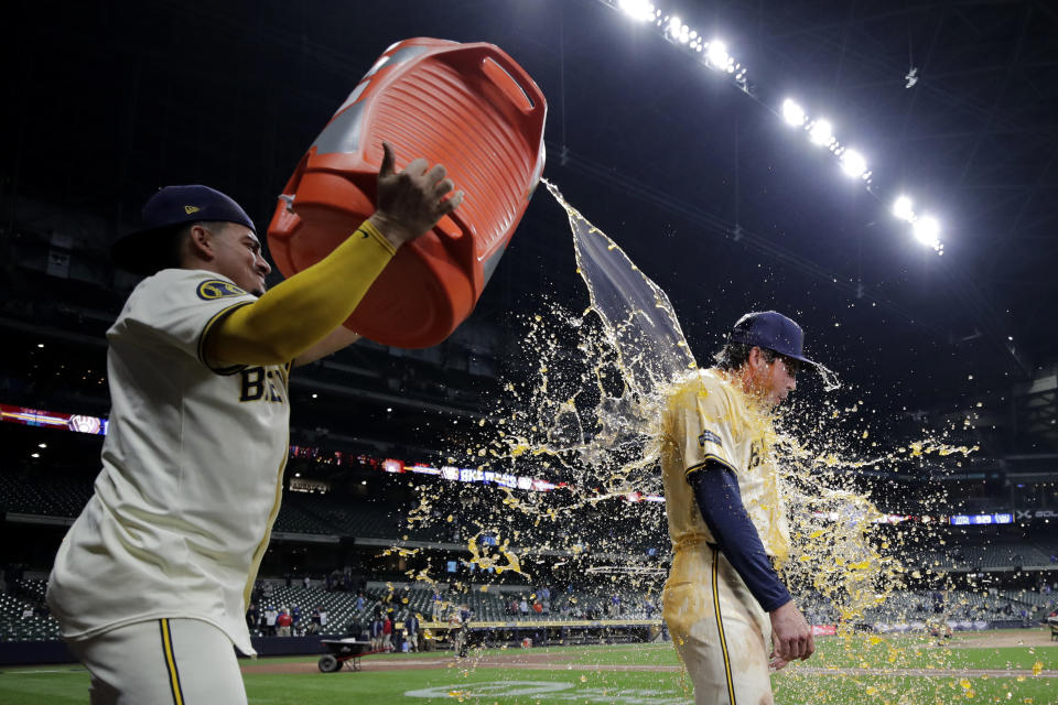 Milwaukee Brewers' Tyler Black is dunked by Willy Adames after a baseball game against the Tampa Bay Rays Tuesday, April 30, 2024, in Milwaukee. (AP Photo/Aaron Gash)