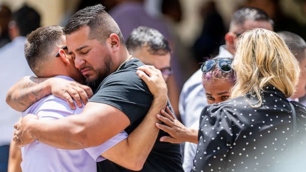 PHOTO: People grieve and embrace outside of Amerie Jo Garza's, 10, funeral service, May 31, 2022 in Uvalde, Texas. (Brandon Bell/Getty Images)