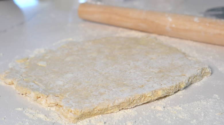 rolling pin with dough rectangle