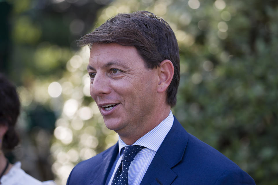 Deputy White House press secretary Hogan Gidley walks back to the West Wing after a television interview at the White House, Tuesday, Aug. 6, 2019, in Washington. (AP Photo/Alex Brandon)