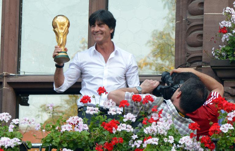 Joachim Loew displays the World Cup trophy on September 9, 2014, two months after leading Germany to glory in Brazil