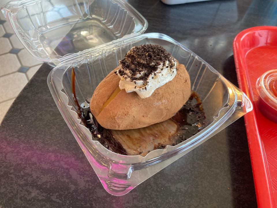 Westside Drive In's famous Idaho ice cream potato is simply vanilla ice cream shaped like a potato and dusted in cocoa powder in a way that makes it look like brown skin. Then it's topped with whipped cream and Oreo crumbles and surrounded in a moat of chocolate sauce.