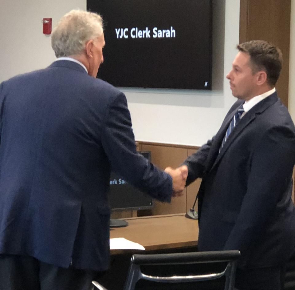 Matthew Toth, right, of Sanford, greets his attorney, Richard Berne, at York Judicial Center in Biddeford, Maine, on Sept. 28, 2023. Toth pled guilty to two counts of unsworn falsification related to his efforts to apply for campaign funds in 2022.