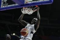 South Sudan center Deng Acuoth (12) dunks the ball during their Basketball World Cup group B match against Serbia at the Araneta Coliseum in Manila, Philippines Wednesday, Aug. 30, 2023. Serbia won.(AP Photo/Aaron Favila)