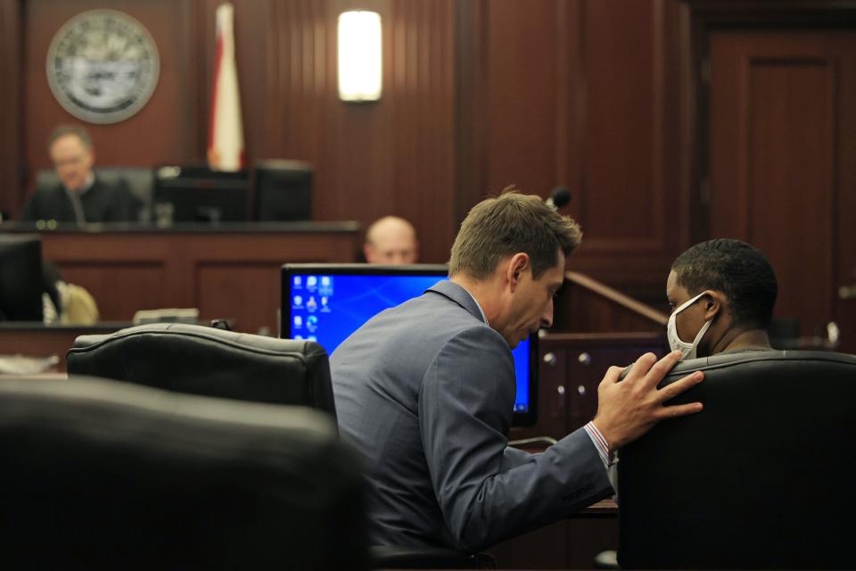 Defense attorney Joshua Beard speaks to Brianna Williams on Tuesday before Circuit Court  Judge Kevin Blazs sentenced her to life in prison for the death of her 5-year-old daughter in 2019.