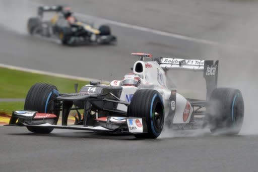 Kamui Kobayashi finished the day fastest in rain-affected practice for the Belgian Grand Prix