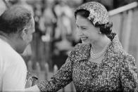 <p>The queen attended a polo match in Windsor in 1958 wearing her always-stylish uniform of a handsome suit, matching hat, and timeless three-strand pearl necklace.</p>