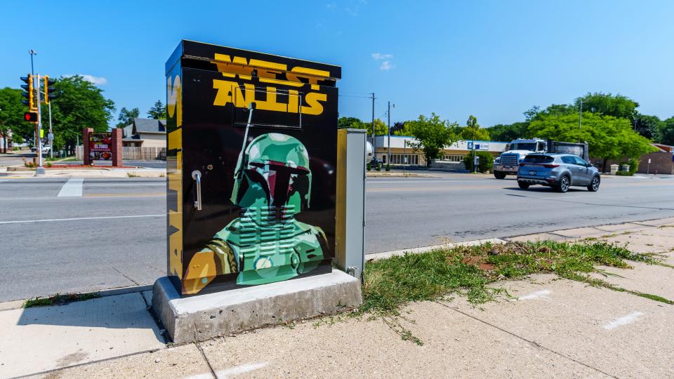 A utility box at 84th & Lincoln is wrapped with art by Ryan Laessig as seen on Friday, July 21, 2023. The box is one of 11 selected for the City of West Allis public art utility box program.