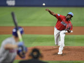 Miami Marlins starter Edward Cabrera delivers a pitch to New York Mets' Mark Canha during the second inning of a baseball game, Saturday, April 1, 2023, in Miami. (AP Photo/Michael Laughlin)