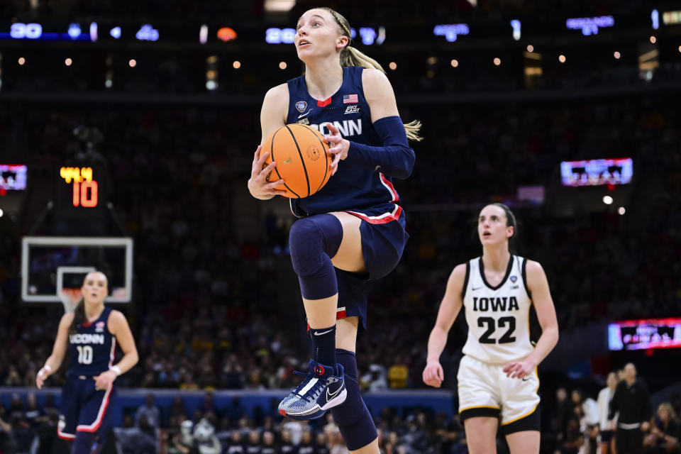 CLEVELAND, OHIO - APRIL 5: Paige Bueckers #5 of the UConn Huskies shoots a layup against the Iowa Hawkeyes during the NCAA Women's Basketball Tournament Final Four semifinal game at Rocket Mortgage Fieldhouse on April 5, 2024 in Cleveland, Ohio. (Photo by Ben Solomon/NCAA Photos via Getty Images)